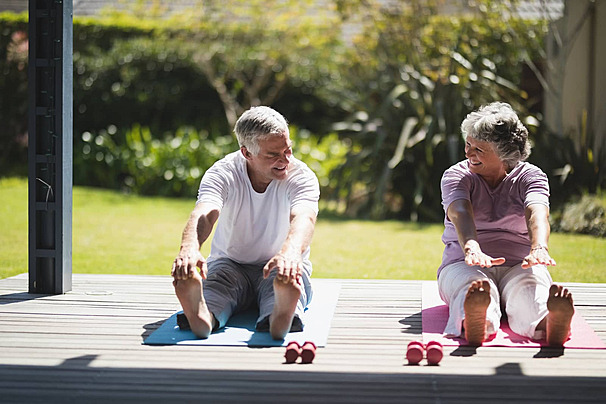 pngtree-elderly-couple-engaging-in-joint-exercise-on-mat-on-their-porch-photo-image_29511424